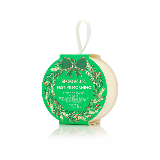 Spongellé festive morning body buffer with green packaging and white background